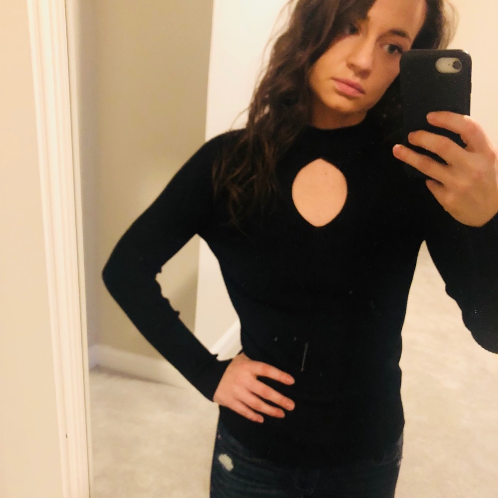 Flattering black top! NWT. Size S.